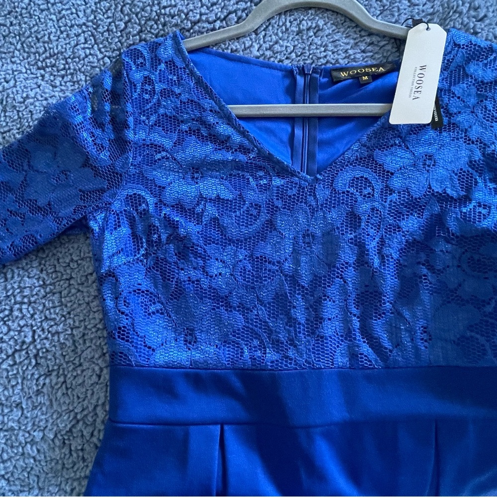 Blue medium dress, fits size 6.NWT